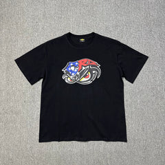 Corteiz Eagle Eye Graphic Black T-Shirt — Patriotic Streetwear Tee with Bold Motorcycle Print